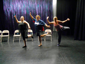 Virgin Valley Theatre Group and Fly Willie workshop participants Patty Amore, Teri Nehrenz and Roberta Brocius show a great deal of enthusiasm as the Fly Willie/Actor’s workshop moves onto the stage.  The actor’s and writer/director/choreographer Dan Nielsen agree that the stage lends a whole new feel to the workshops. Photo by Teri Nehrenz