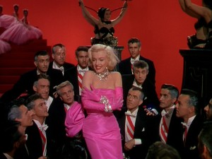 Screenshot of Marilyn Monroe from Gentlemen Prefer Blondes. A young Robert Fuller seen top right.