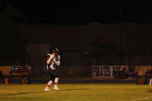 Senior running back Junior Paongo receives a kickoff during a recent game. Paongo led the Bulldogs with 117 yards Friday night in a win over Boulder City 27-21. Photo by Lou Martin