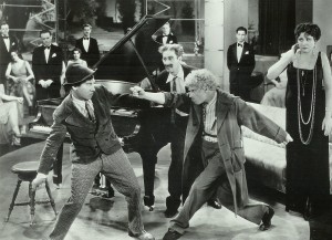 4. The Marx brothers in Animal Crackers as Margaret Dumont  looks on