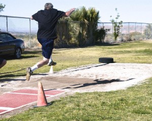 Ron Damschen of San Diego does the Men’s Long Jump competition. Photo by Burton Weast