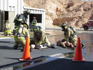 Three members of the fire department attempt to revive the three victims, although unsuccessful. Photo by Stephanie Frehner.