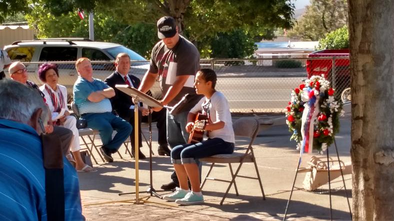 Hughes Middle School 7th Grader Cecelia Gomez performed a song that she and her father had written and dedicated to her uncle who served several tours in recent wars. The video of her performance can be seen on the MLN’s Facebook page. Photo by Stephanie Frehner. 