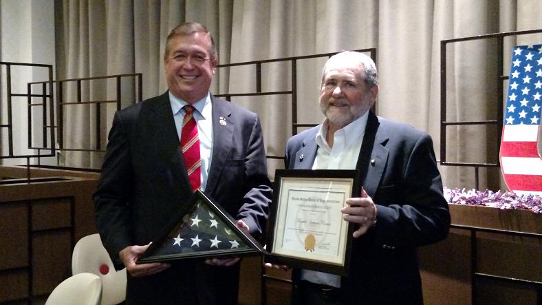Chuck Caldwell accepted a certificate and special flag on behalf of the Mesquite Veterans Center from Congressman Cresent Hardy on Monday at the WWII breakfast. Photo by Stephanie Frehner. 