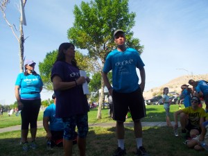 Pam Bruehl coordinator for the Mesquite Walk in Memory/Walk for hope along with Director, Brad Easton, of the Mesquite Behavioral Health Center address the crowd of supporters before the beginning lap of the 2015, 4th annual event aimed at raising suicide awareness throughout the state of Nevada. Photo by Teri Nehrenz.