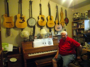 Blair Adams displays an impressive collection of guitars, banjos and mandolins on the walls of his office/studio. 
