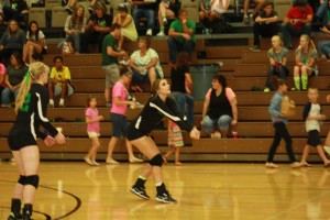 Kaydee Bingham sets a Miners serve during the Dawgs 3-0 win over Sunrise High School Thursday night. Photo by Lou Martin
