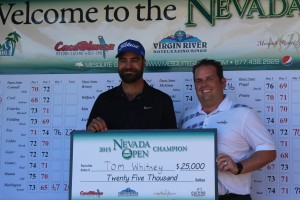Tom Whitney, left, took home the largest purse in the history of the Nevada Open played at the Palms and CasaBlanca golf courses in Mesquite. He shot 14 under par in three rounds. He accepted his $25,000 winnings from Christian Adderson, Tournament Director for Mesquite Gaming. Photo by Barbara Ellestad.