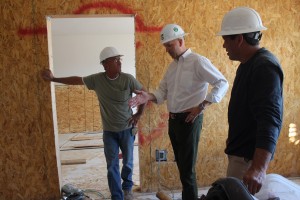 Andre Carrier, center, COO of Rising Star Sports Ranch Resort and Eureka Casino Resort discusses renovation plans of the old Mesquite Star hotel with two construction workers, Ken Howard, left, and Kris Wirth. Photo by Barbara Ellestad.