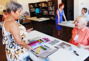 Bunny Wiseman, left, gives personalized help to each of her drawing students. Photo by Linda Faas.