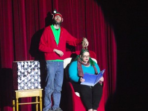Matt McDonald, left, and Jenna Grubb wrote several scripts for skits for the Sixth Annual Community Christmas Concert held at the Mesquite Community Theatre on Dec. 4 and 5.  McDonald and Grubb perform a skit about ‘The Night Before Christmas.’ Photo by Teri Nehrenz.