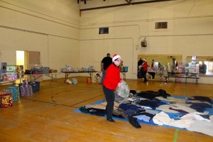 Salvation Army volunteers sorted and organized a great many toys for the Toys for Tots distribution on Dec. 18.  The coats in the middle of the gymnasium floor were collected as part of the Coats for Kids Program and donated to the Toys for Tots by Joe Aquino, Local Volunteer Coordinator for the Coats for Kids Program.  Photo by Teri Nehrenz.