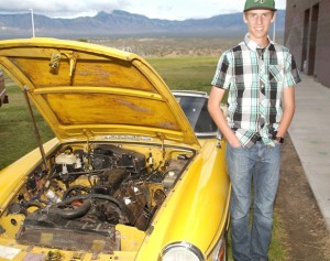 Nathan Cannon and his about-to-be-restored 1978 MGB roadster on display at the Virgin Valley High School Career and Technical Education and Arts Night on April 28. Photo by Burton Weast.