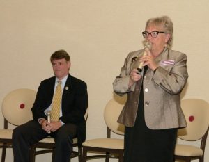 AD 19 candidate Connie Foust addresses the Forum as Assemblyman Chris Edwards looks on. 