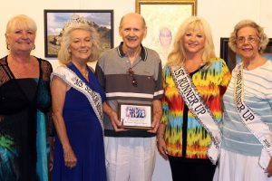 2016 Ms. Senior Mesquite and her court present videographer Paul Boussard with a special plaque to thank him for his years of dedicated service to the Ms. Senior Mesquite Pageant.  From left, Judy Brittain, Jean Hardman Ms. Senior Mesquite 2016, Paul Broussard, Gail Laird First Runner Up and Elizabeth Merrill Second Runner Up.  Photo by Teri Nehrenz