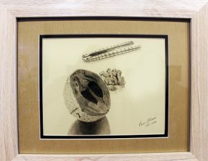Surreal Art 5-31-16 01:  On display in the Mesquite Fine Arts Gallery May 30 – June 25 as part of the ‘It’s Surreal’ exhibit is a Dry Media Piece by artist Pam Olsen titled ‘Golf Nut.’  Photo by Teri Nehrenz