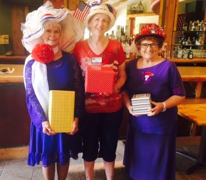 Winners of the Patriotic Red Hat contest are from left, Bonnie Mikkelsen, Joyce Stafford and Valerie Thompson. Photo submitted.