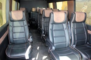 Brand new state of the art busses will provide you door-to-door service for your camel adventure from the Eureka Hotel Casino.  Busses are equipped with charging ports for every seat.  Photo by Teri Nehrenz 