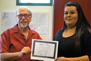 Life changing 10-6-16: Mesquite Mayor Al Litman, left, presents a $15,000 scholarship from Stevens-Henneger College to Karla Viera-Garcia who intends to pursue a nursing degree in a life-changing opportunity. Photo by Teri Nehrenz.
