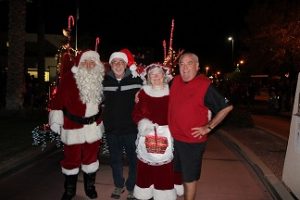 Santa and Mrs. Claus took a moment after the first parade in 2015 for some PR with Mayor Al Litman and Councilman Geno Withelder before the Christmas Tree Lighting. Photo by Stephanie Clark. 