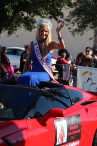 Ms. America International, Tracy Rodgers, Rides in celebration and honor of Veteran’s all over in the 2016 Mesquite Veteran’s Day Parade. Photo by Teri Nehrenz