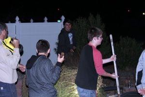 Boy Scout Troop #42 came out after dark with flashlights and shovels to help elderly Beaver Dam snowbirds, the Jensens, with a little yard work courtesy of their neighbors the Weavers. Photo by Teri Nehrenz