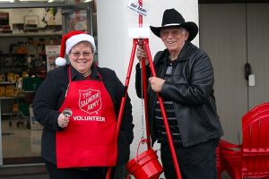 Jacqueline and Blair Adams are the first bell ringers to kick off the 2016 Salvation Army kettle campaign. Jacqueline has been ringing the bell for the collections every Monday morning for the past 12 years and hubby Blair has joined her for the past four. Photo by Teri Nehrenz  