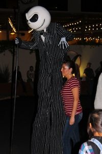 Jack Skellington loomed above the crowd keeping a close eye on his eerie subjects. Some even stopped to have their pictures taken with the very tall King of Halloween Town. Photo by Teri Nehrenz